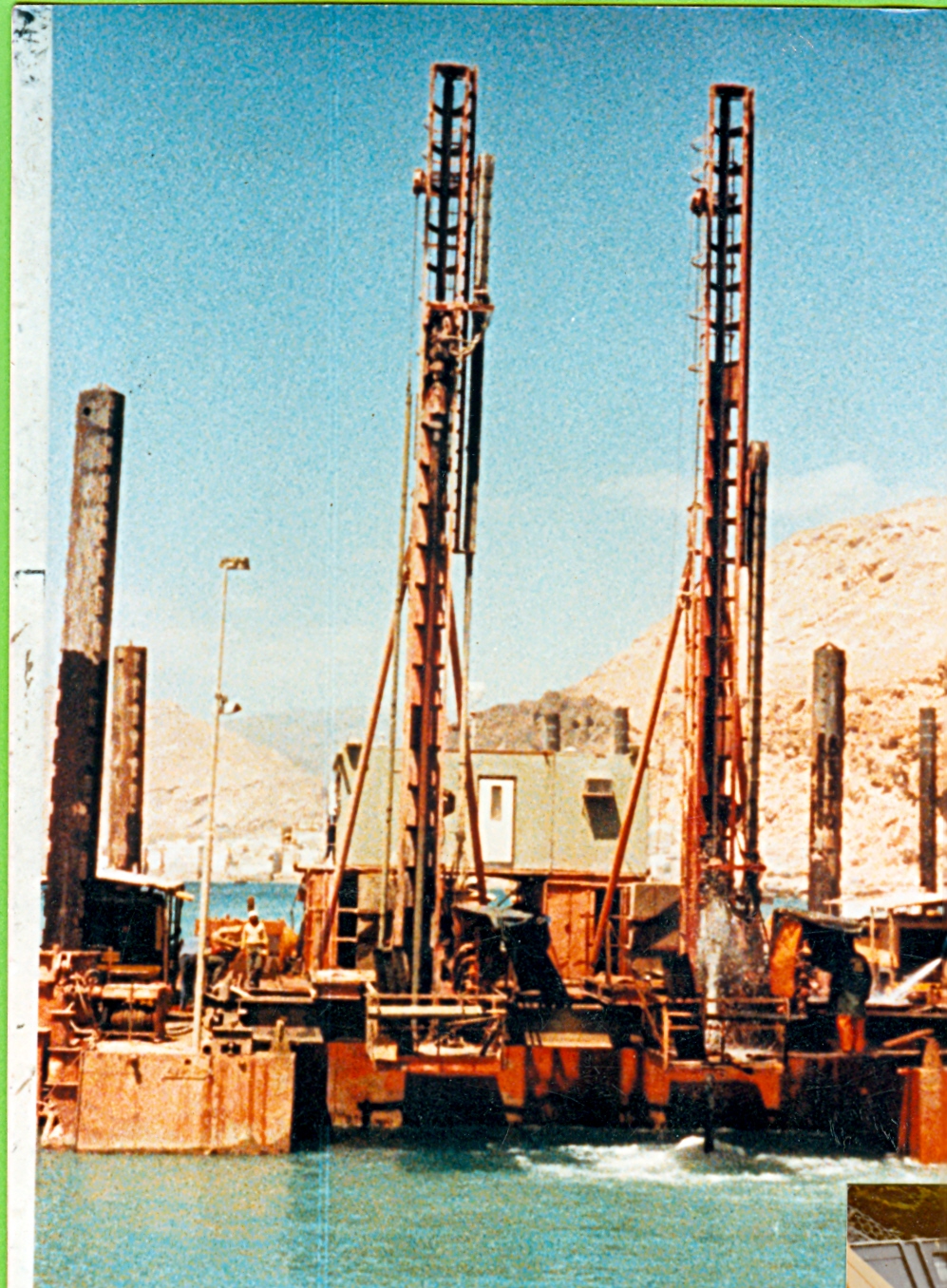 Machine for drilling, underwater blasting, not requiring a diver for placement of explosives