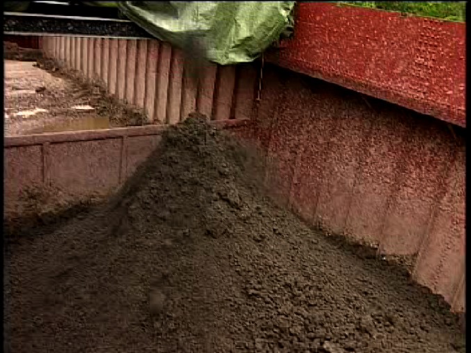 Dry soil from dredged sludge
